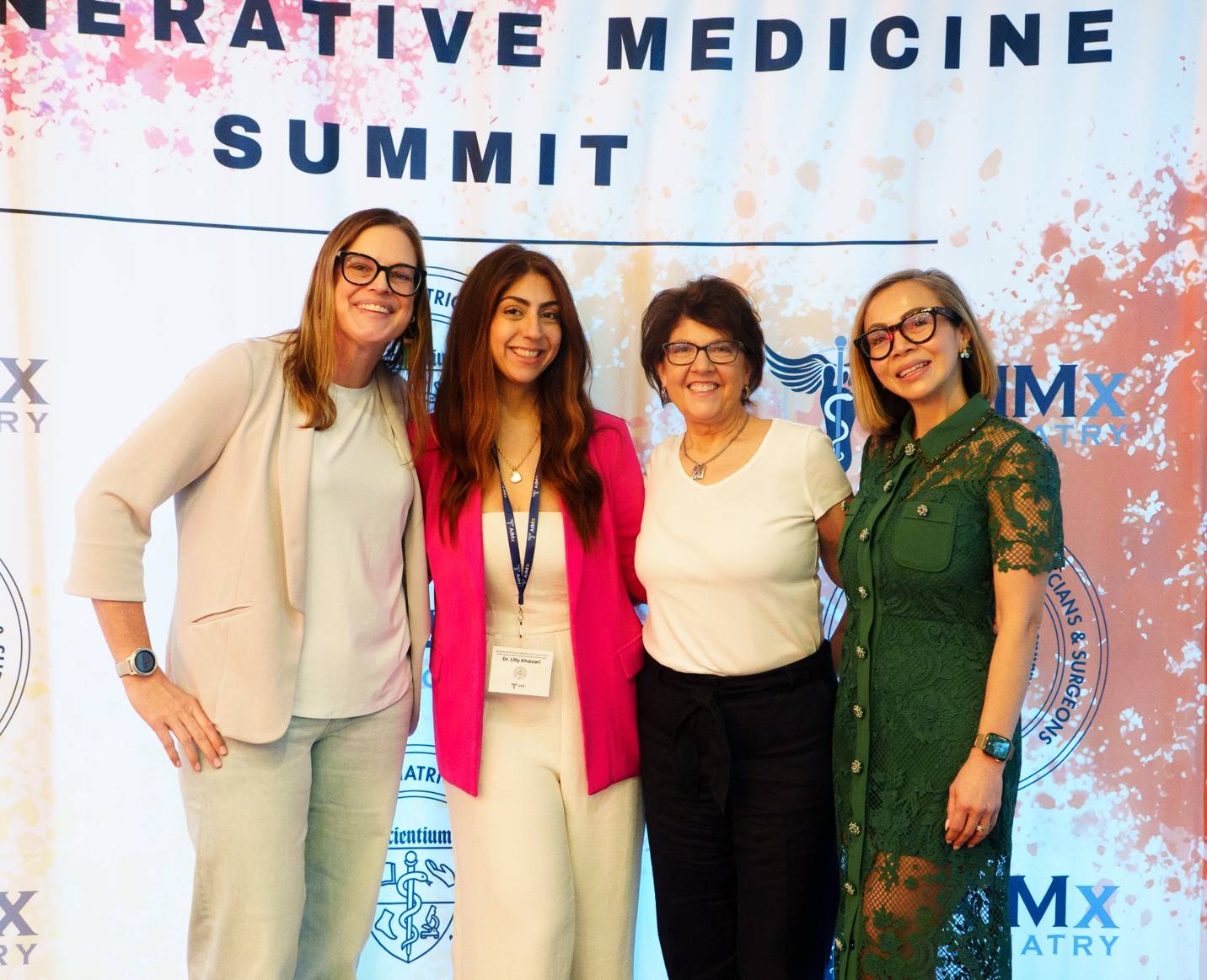 Four APBFRM physicians posing in front of the Regenerative Medicine Summit backdrop
